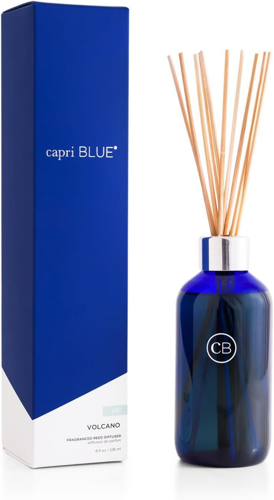 Capri Blue Volcano reed diffuser in a cobalt blue bottle with natural reeds and matching blue box