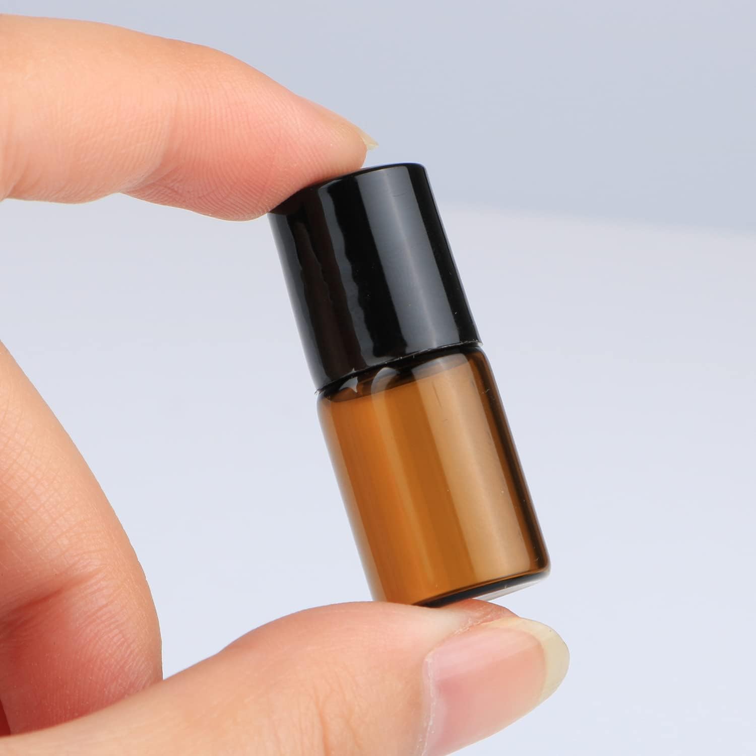 Wresty 25 Pcs Essential Oil Glass Roller Bottles Mini Tiny Refillable Empty Aromatherapy Perfume Liquid Amber Glass Roll On Bottles Vials Metal Rollerball Bottles Jar (2ml)