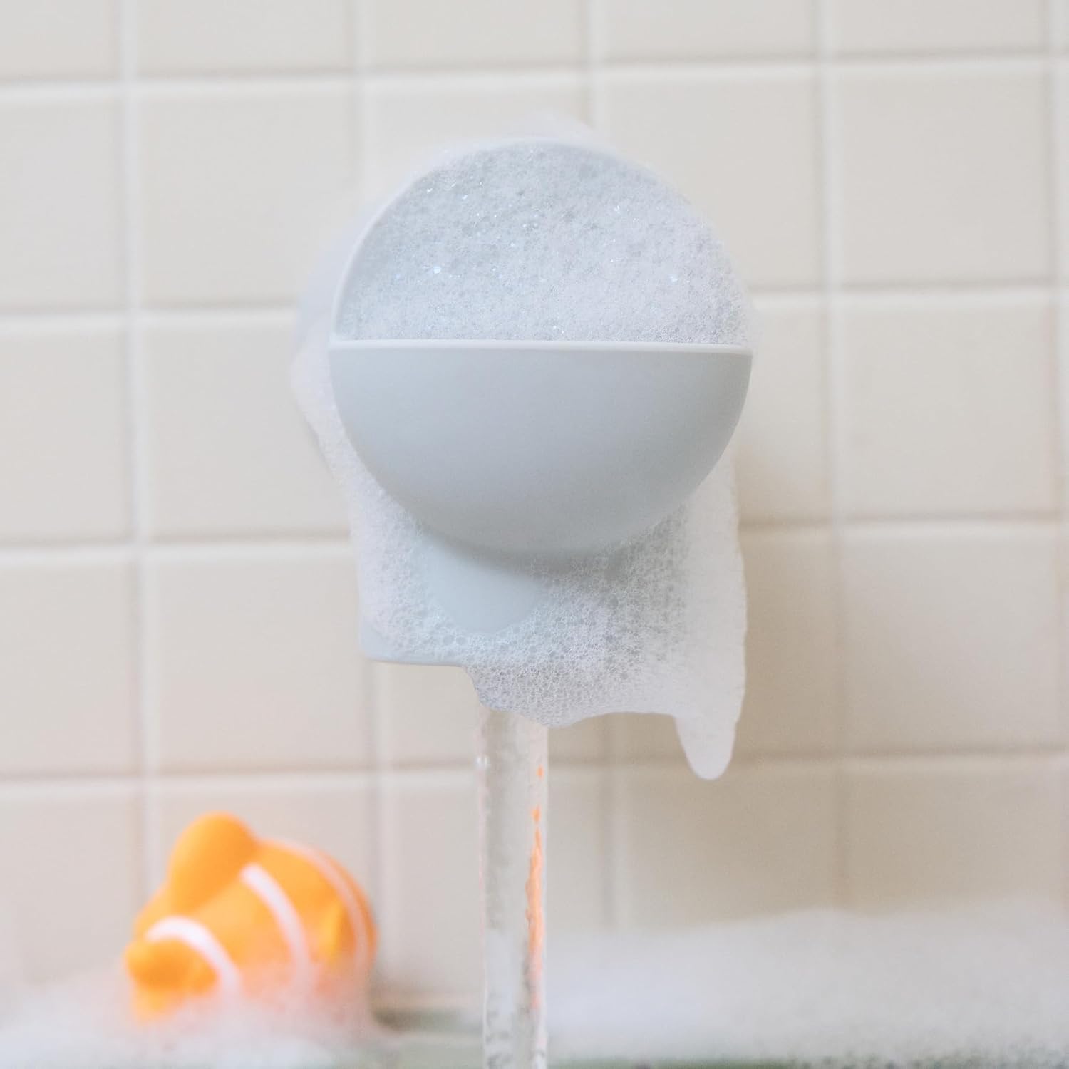 Munchkin® Soft Spot™ Bath Spout Cover for Baby, Bathtub Guard with Built-in Bubble Bath Dispenser, Silicone, Grey