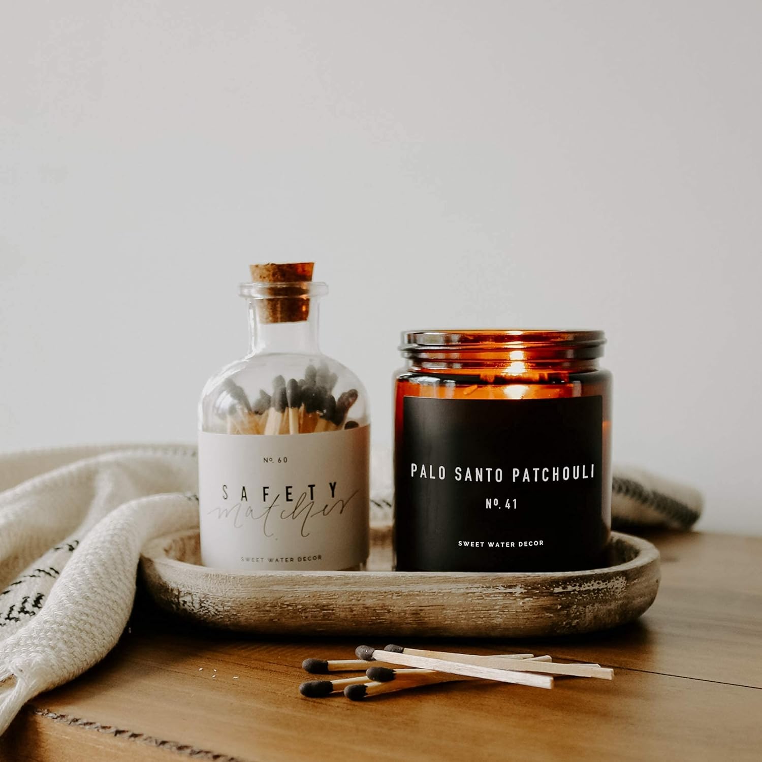Sweet Water Decor Palo Santo Patchouli Candle - Vanilla, Musk, Sandalwood, Patchouli Scented Soy Spa Candles for Home - Gifts for Women, Men - 9oz Amber Jar, 40 Hour Burn Time